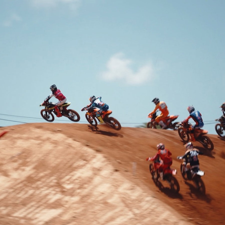 MX bikes flying over a jump