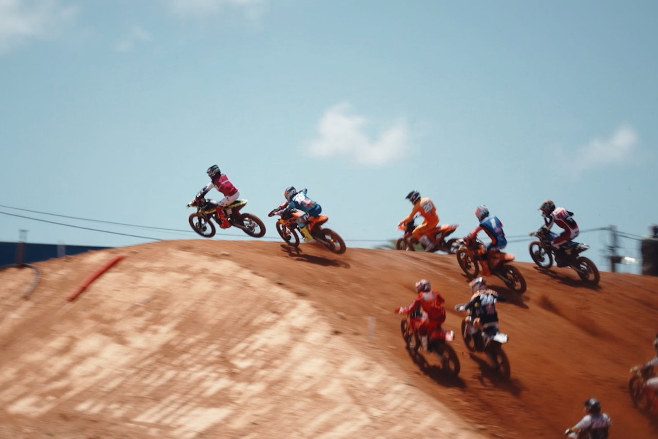 MX bikes flying over a jump