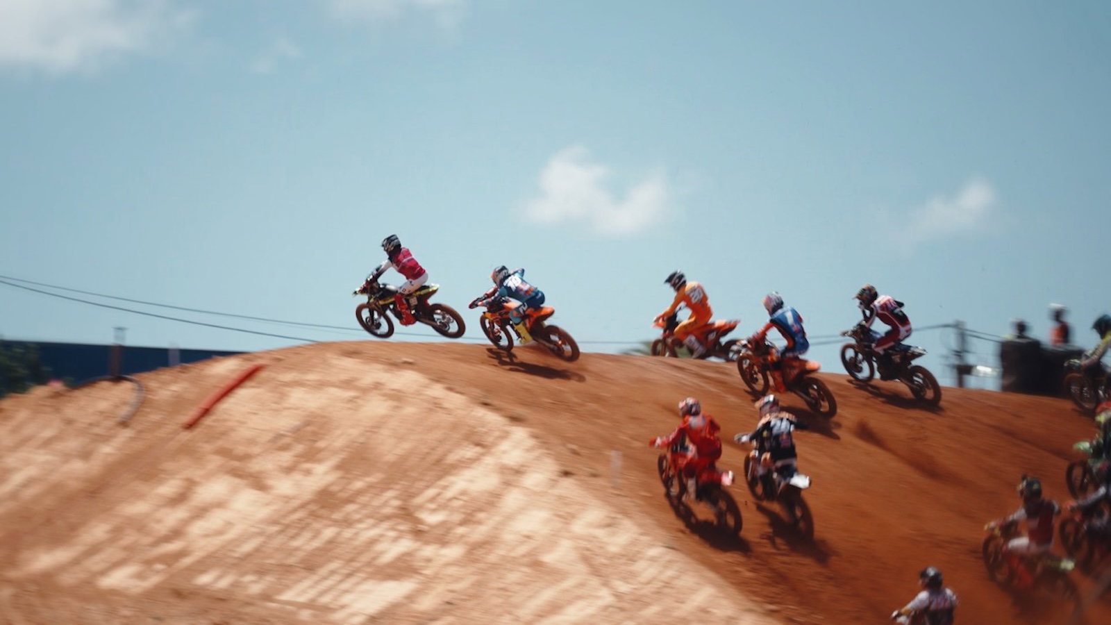 MX bikes flying over a jump