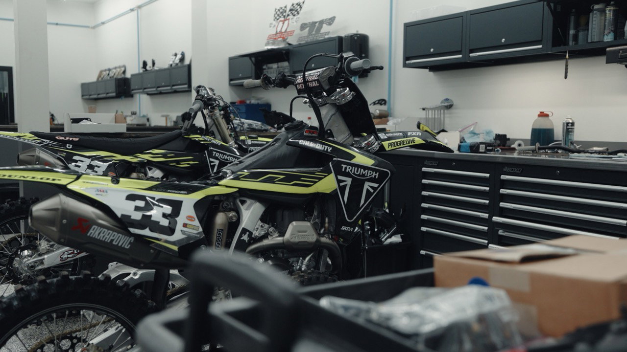 Triumph Factory Racing MX bikes in a workshop