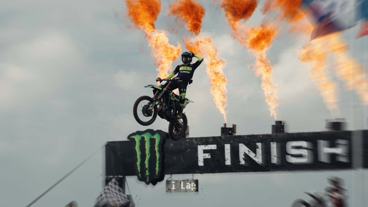 A Triumph MX bikes flying over the finish line