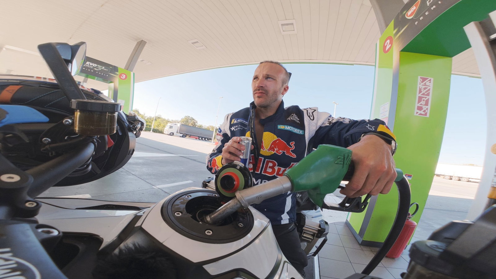 Sam filling up his Tiger 1200 in Serbia | Baptiste Fauchille / Red Bull Content Pool