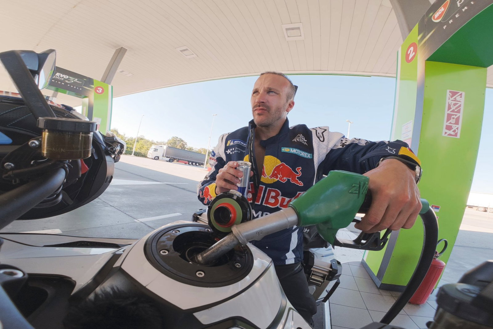 Sam filling up his Tiger 1200 in Serbia | Baptiste Fauchille / Red Bull Content Pool