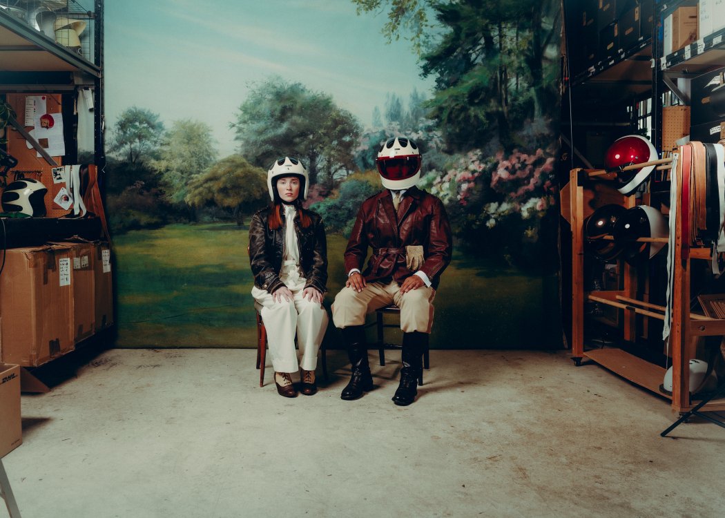 A man and woman wearing the new retro helmets.