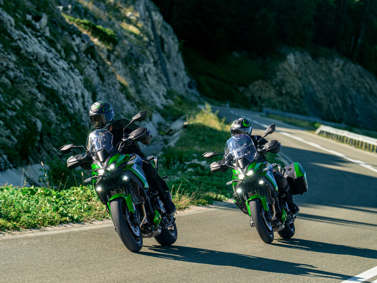 New Kawasaki Versys 900 motorcycles on the road.