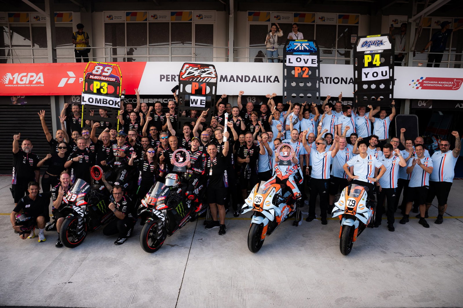 Aprilia and its riders celebrating at Mandalika.