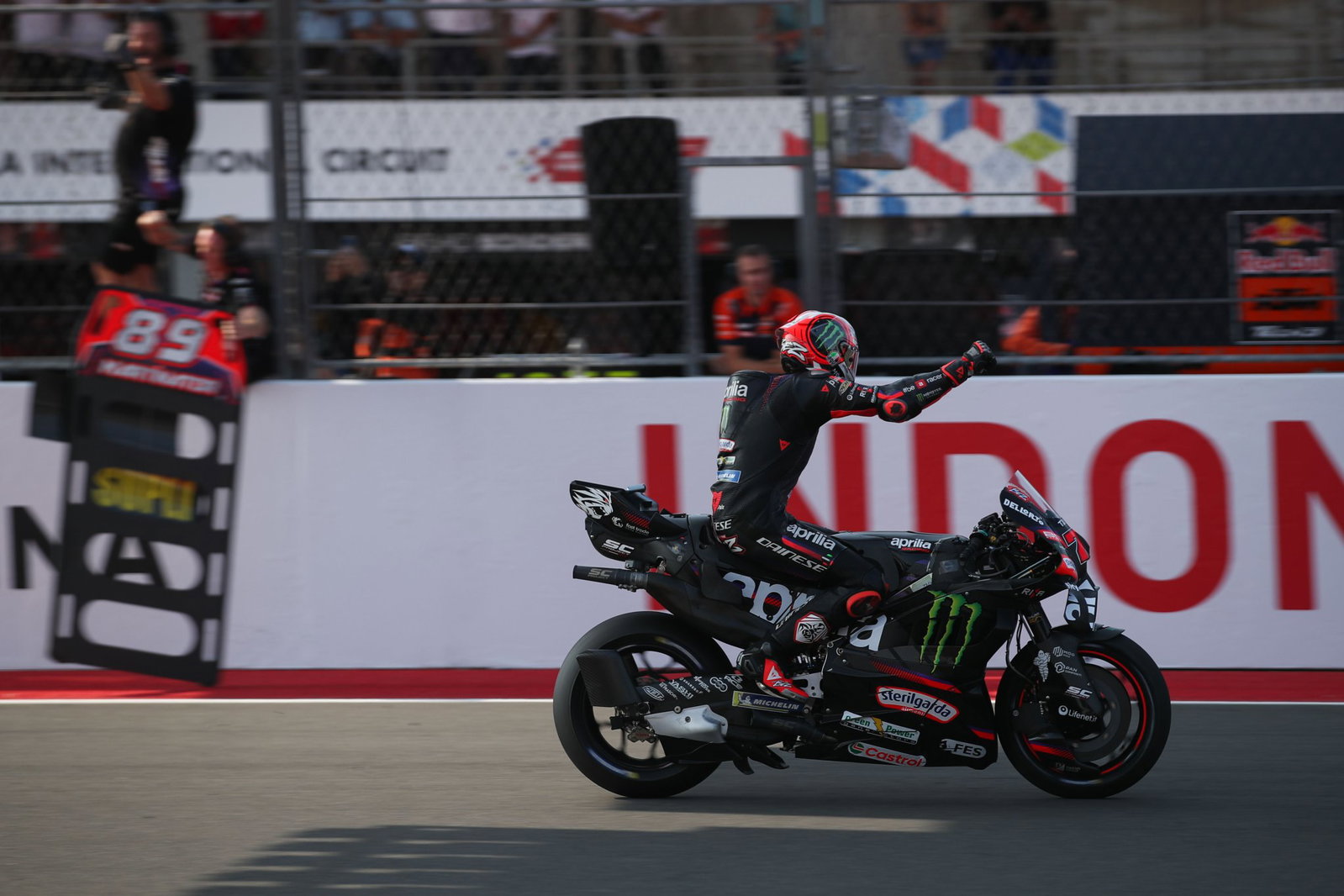 Marco Bezzecchi crossing the line to win at Mandalika. Credit: Gold and Goose.