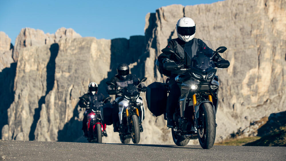 3x 2023 Yamaha Tracer 9 GT+ on mountain road. - Yamaha