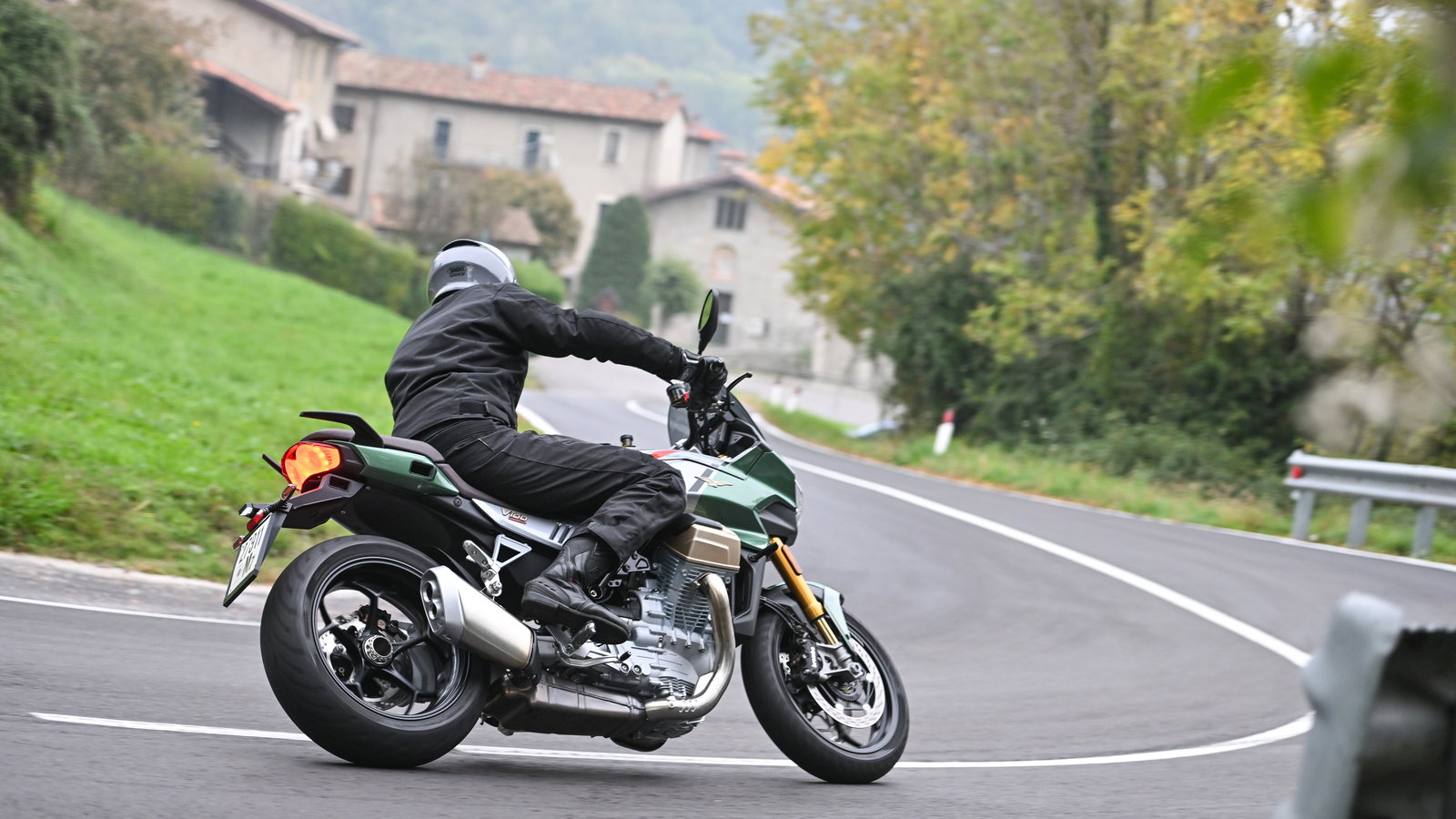 rear shot riding moto guzzi v100 mandello