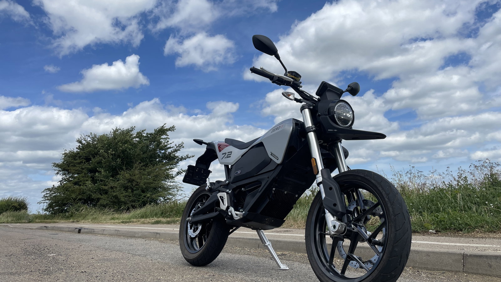 Zero Motorcycles FXE 7.2 11KW and blue sky with clouds.