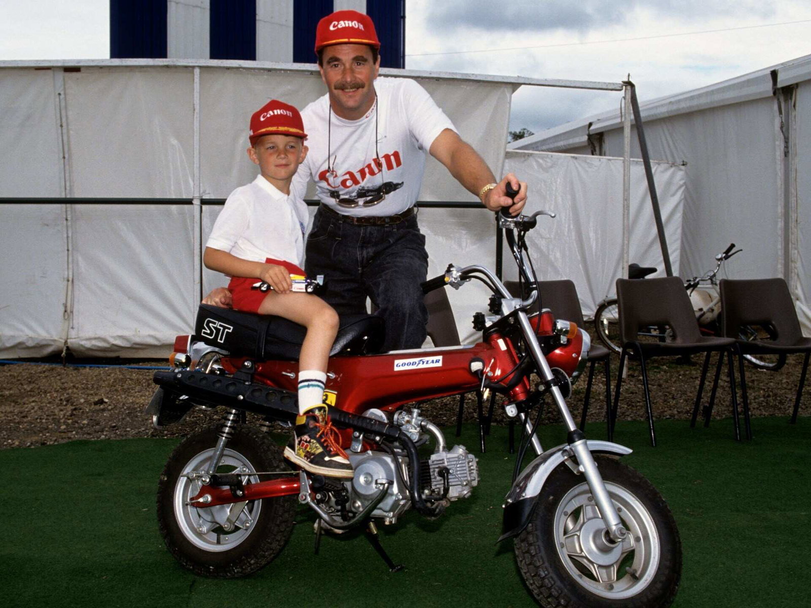 Nigel Mansell with his Ferrari branded Honda DAX ST50