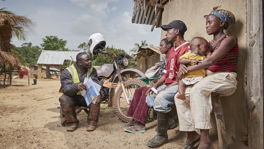 Two Wheels for Life, healthcare worker speaking to family.