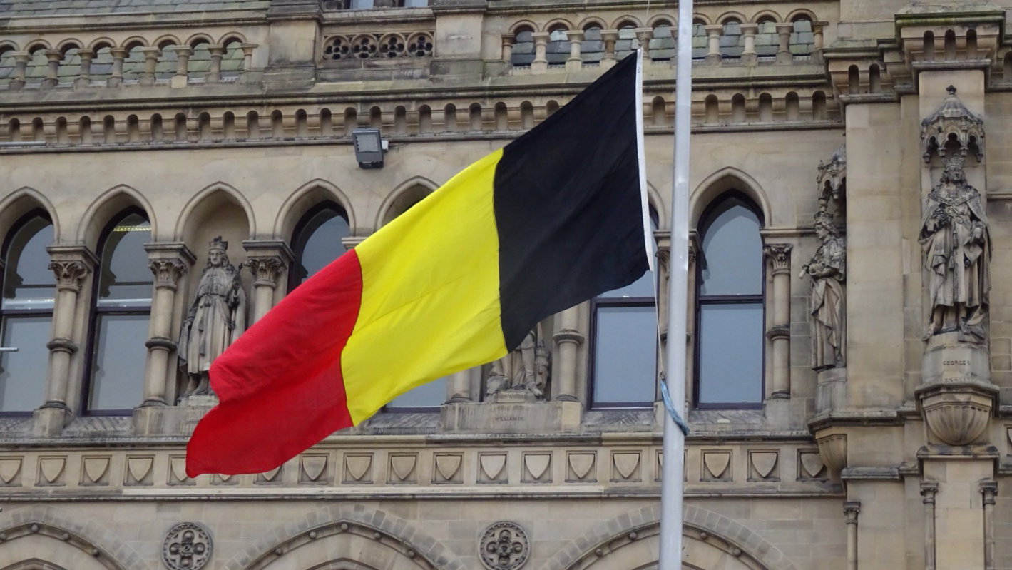 "Belgian flag at Half-mast, City Hall, Bradford" by sgwarnog2010, licensed under CC BY-NC-SA 2.0.