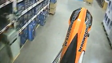 KTM stunt fiend wheelies through DIY superstore