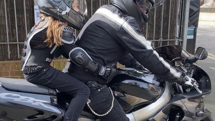 A Honda Fireblade with a young pillion 