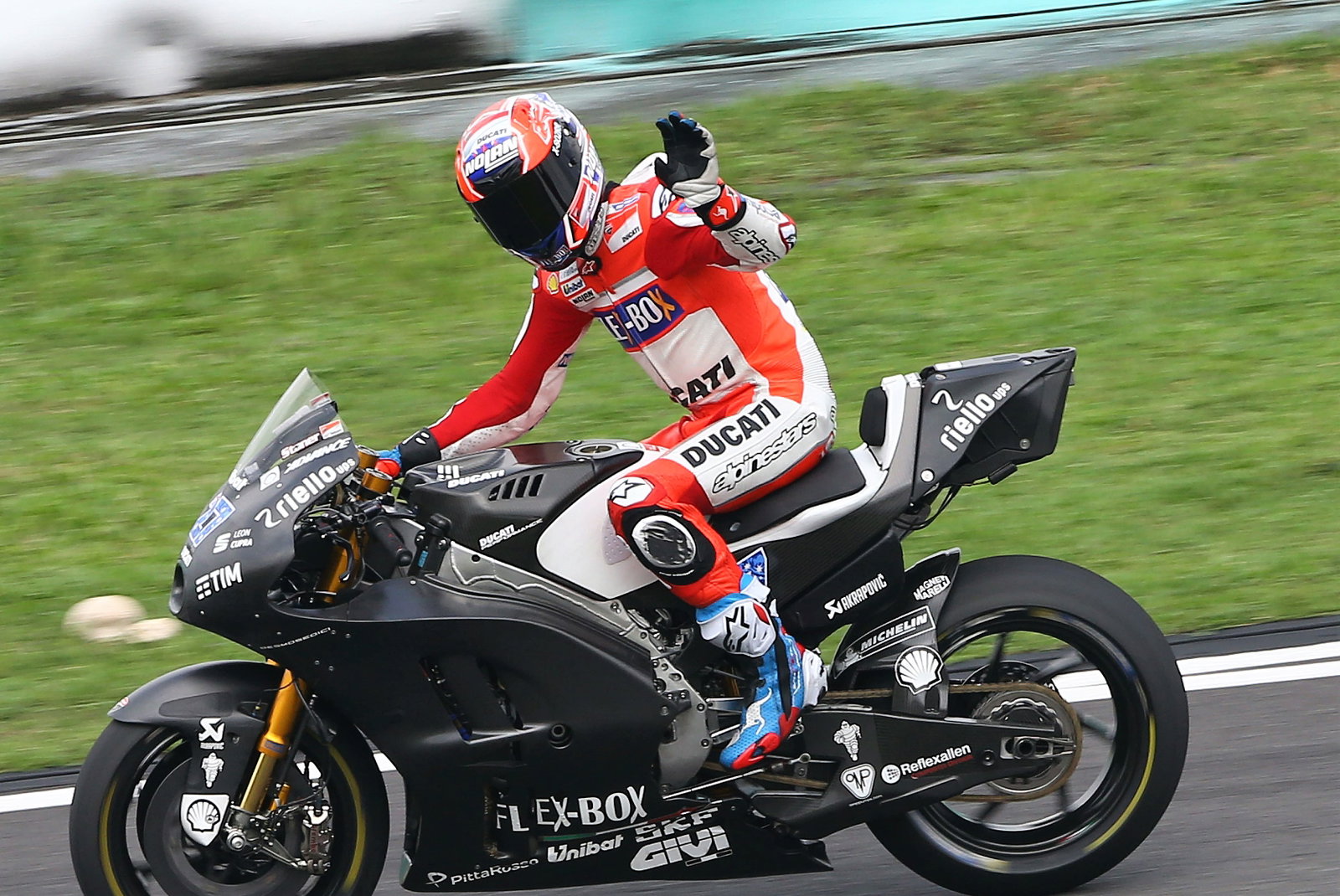 Petrucci skates clear of Marquez in soaking wet FP2