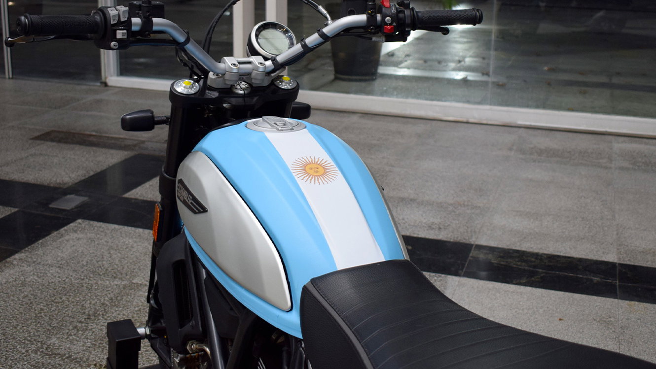 Ducati Scrambler with Argentinian flag paint on fuel tank. - Ducati Media