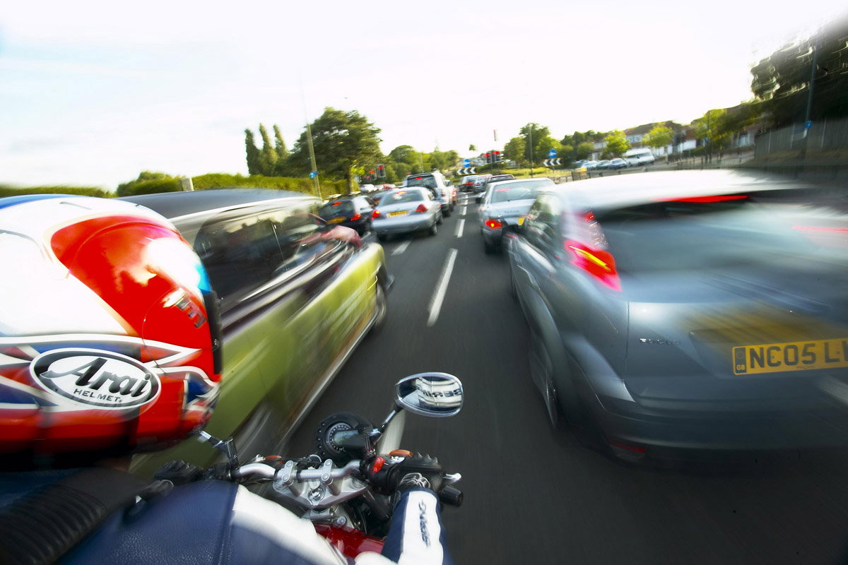 Incredible police footage shows phone-snatching thief riding scooter wrong way up motorway