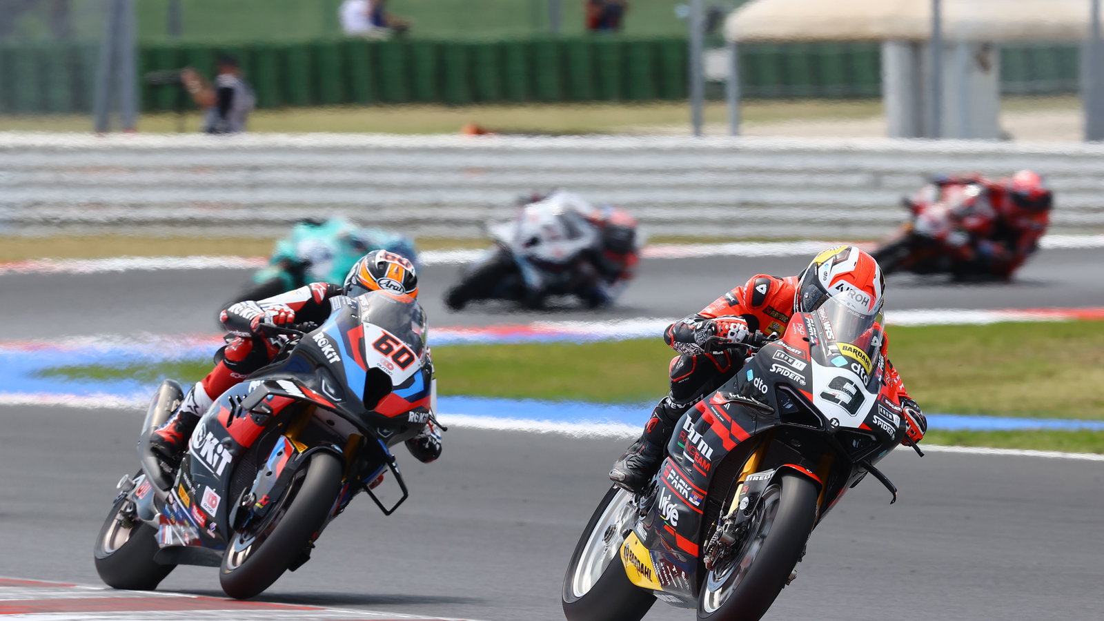 Danilo Petrucci leads Michael van der Mark, 2024 Emilia-Romagna WorldSBK. - Gold and Goose