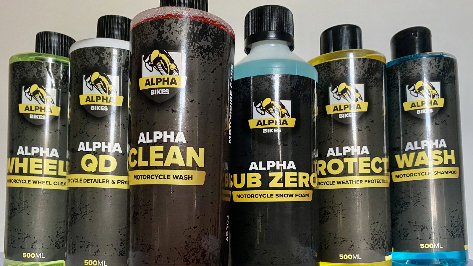 Six bottles of Alpha Bikes products