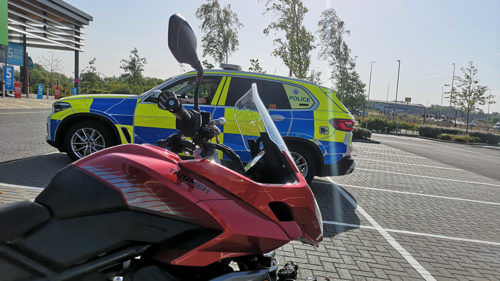 Triumph Tiger Sport 660 and police car