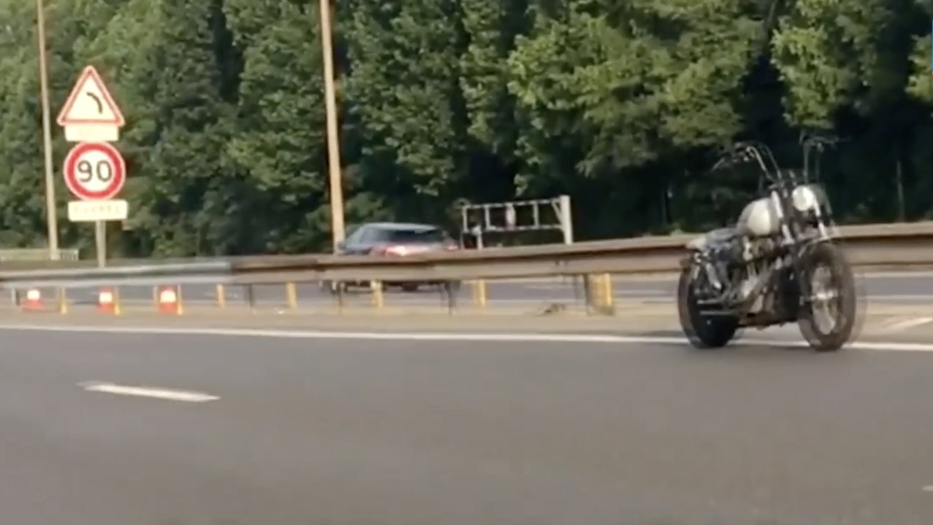 A Harley-Davidson Dana moving along a road without a rider