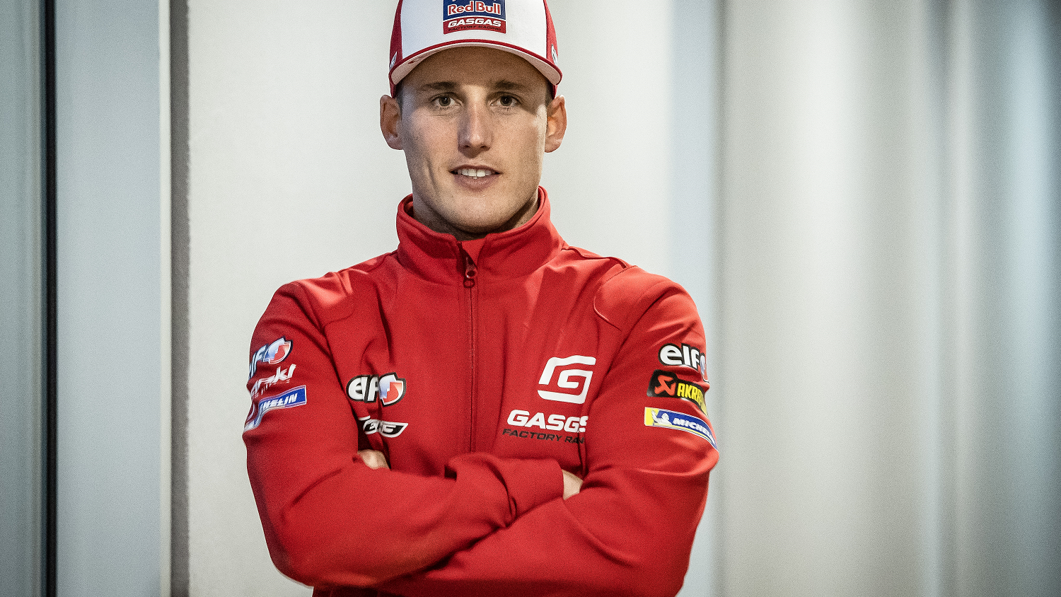 Pol Espargaro in GasGas jacket & cap. - Gold and Goose